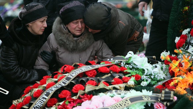 Relatives pay tribute to Ukraine's Sergey Lobov, who was killed during shelling, during his funeral at a cemetary in Mariupol on Jan. 27, 2015.  