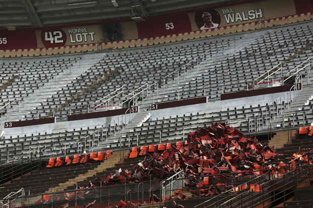 The names of former San Francisco 49ers head coach Bill Walsh and defensive player Ronnie Lott are shown among a stack of seats removed from Candlestick Park in San Francisco, California, Feb. 4, 2015. 