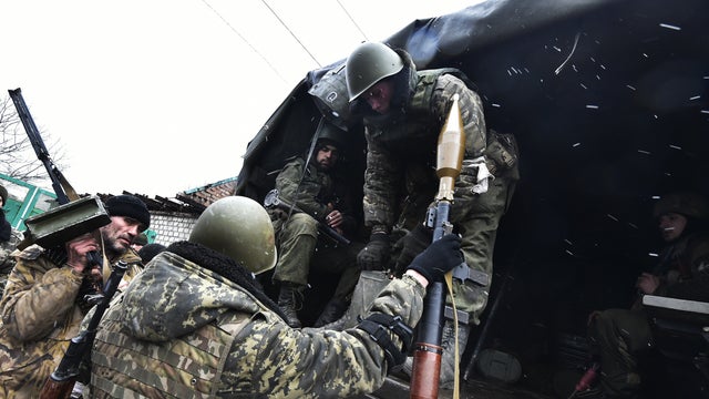 Pro-Russian separatists go to the front on Feb. 9, 2015 in Uglegorsk, 6 kms southwest of Debaltseve. 