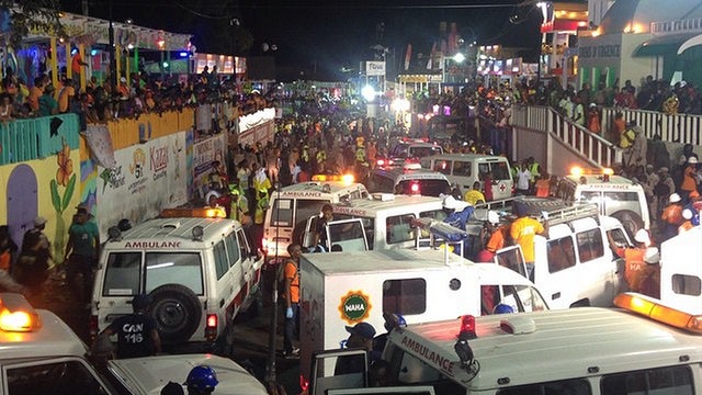 ​Emergency service vehicles and personnel attend the scene of a fatal accident during a Carnival float procession in Port-au-Prince 