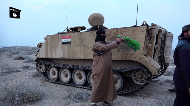 ​An online video released by the Islamic State of Iraq and Syria purports to show militants seizing a weapons cache in Iraq. 