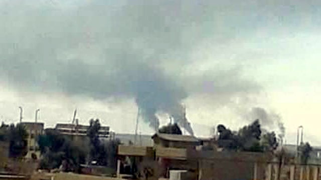 ​An image posted online by Assyrian Christians in northeast Syria on Feb. 23, 2015 shows smoke rising where ISIS militants were fighting with Kurdish forces near the town of Hassakeh 