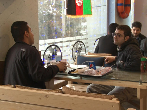 Qais Mahihani, a Kabul resident seen at right enjoying a meal with a friend on Feb. 23, 2015, quickly became a regular at "Mr. Cod" 