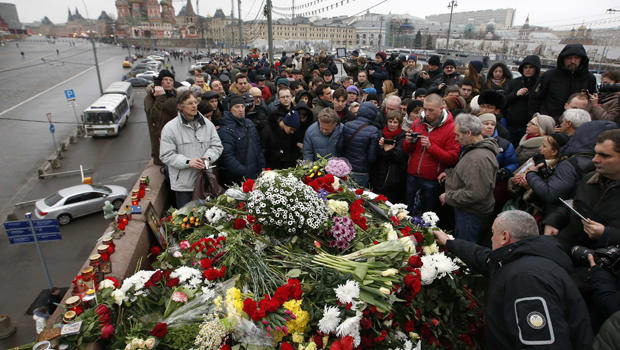 People gather at the site where Boris Nemtsov was recently murdered with St. Basil's Cathedral seen in the background in central Moscow Feb. 28, 2015. 