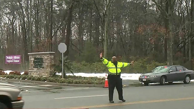 ​Authorities direct traffic following a small plane crash in Norfolk, Virginia, March 4, 2015. 