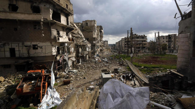 ​Damaged buildings are seen at al-Amriya frontline in Aleppo, Syria, March 3, 2015, in this picture taken from a rebel-held area. 