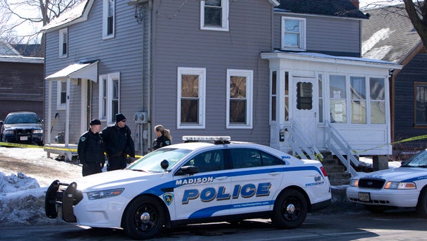 Madison Police investigate the scene of a police-involved shooting at a home in Madison, Wis., March 7, 2015.