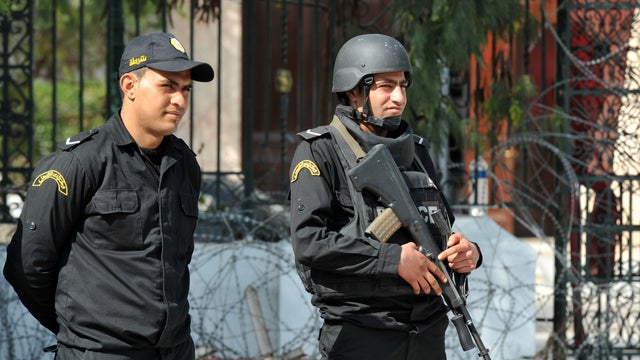 Tunisian security forces stand guard outside the National Bardo Museum in Tunis 
