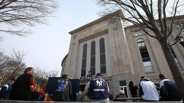 Fans go through metal detectors at Yankee Stadium