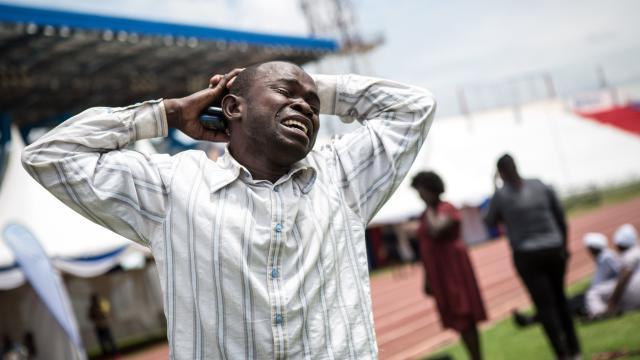 A man is overcome with grief after learning that a relative was killed by al-Shabaab militants during the siege on the Garissa University College, at Nyayo Stadium in the Kenyan capital 