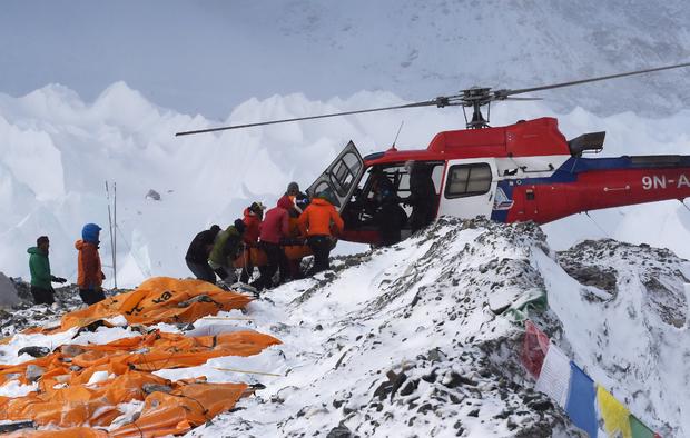 Injured person is loaded onto rescue helicopter at Everest Base Camp on April 26, 2015, day after avalanche triggered by powerful earthquake devastated the camp 