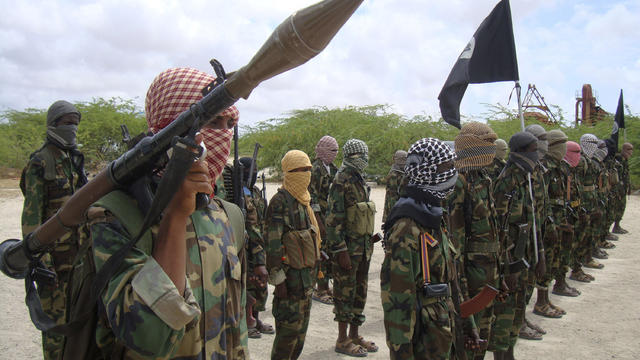 Al-Shabab fighters display weapons as they conduct military exercises in northern Mogadishu, Somalia, on Oct. 21, 2010. 