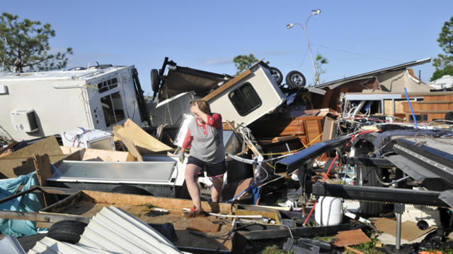 Sharon Odom looks over what is left of her RV at the Roadrunner RV Park in Oklahoma City, Oklahoma, May 7, 2015. 