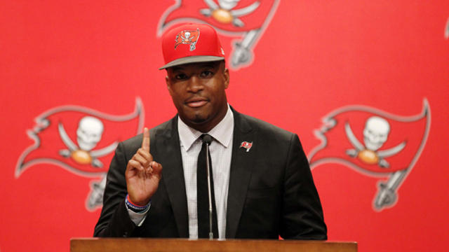 Tampa Bay Buccaneers quarterback Jameis Winston (3) is introduced at a press conference at One Buc Place the day after being selected as the number one overall pick in the NFL draft May 1, 2015, in Tampa, Florida. 