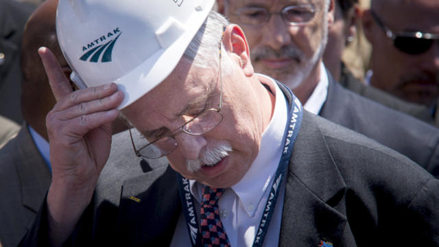 Amtrak CEO Joseph Boardman removes his hard hat before speaking at a press conference two days after an Amtrak passenger train derailed in Philadelphia, Pennsylvania, May 14, 2015. 