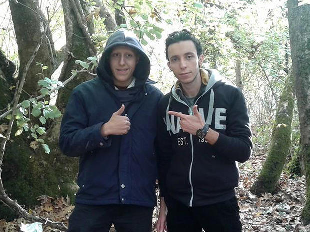 Khaleel (left) and Mohammed stop to pose for a photo during an attempt to walk across the Balkan Mountains into Albania 