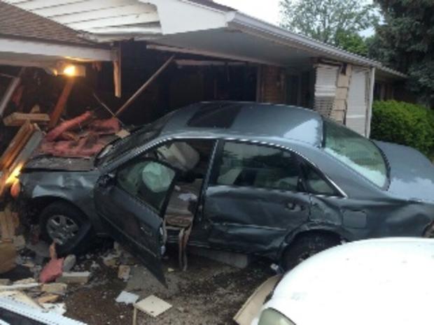 Car crashes into Shelby Township home 