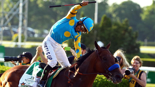 Victor Espinoza celebrates atop American Pharoah, No. 5, after winning the 147th running of the Belmont Stakes at Belmont Park June 6, 2015, in Elmont, New York. 
