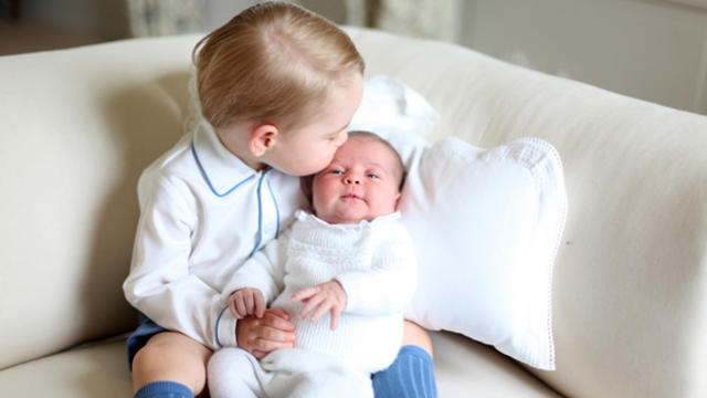Britain's Princess Charlotte is held by her brother, 2-year-old Prince George, in this image taken by Kate, Duchess of Cambridge, at Amner Hall, England, in mid-May 2015 and made available by Kensington Palace June 6, 2015. 