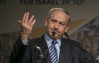 Israel's Prime Minister Benjamin Netanyahu gestures as he addresses the Jewish Agency Assembly in Tel Aviv, Israel 