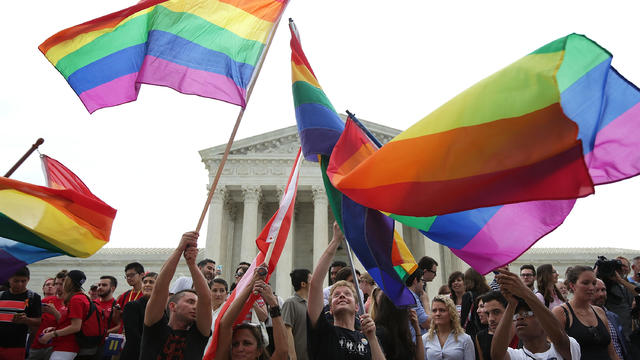 Same-sex marriage supporters rejoice after the U.S. Supreme Court hands down a ruling regarding same-sex marriage June 26, 2015, outside the Supreme Court in Washington. 