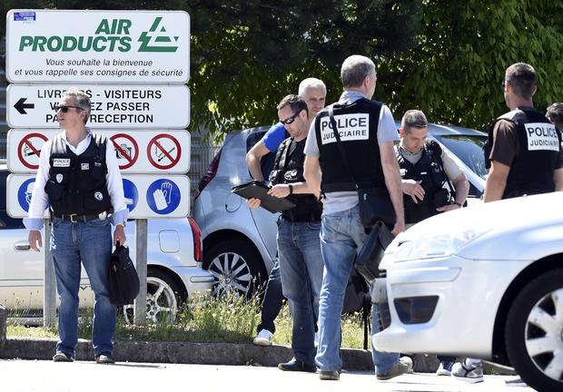 French police secure the entrance of the Air Products company in Saint-Quentin-Fallavier, near Lyon, southeastern France, June 26, 2015. 