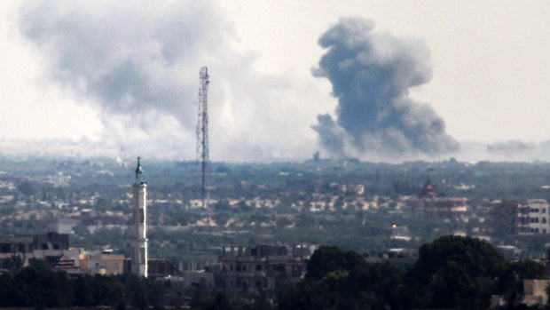 A picture taken from the Rafah border of the southern Gaza Strip with Egypt shows smoke billowing in Egypt's North Sinai July 2, 2015. 
