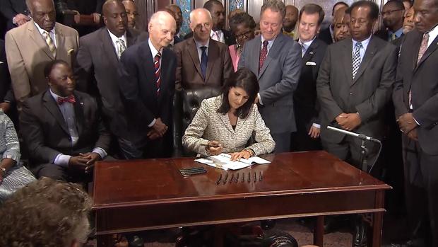 South Carolina Gov. Nikki Haley signs bill requiring removal of Confederate flag from state capitol grounds, on July 9, 2015 