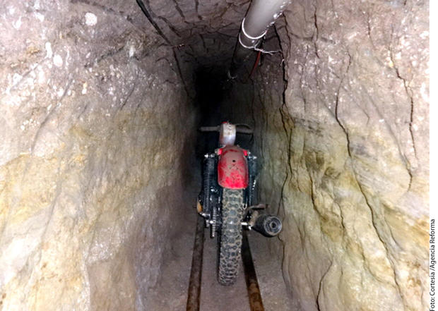 A motorcycle sits on rails inside the alleged escape tunnel that was constructed three stories underground through dirt and rock for Joaquin "El Chapo" Guzman's escape from a Mexican prison in 2015. 