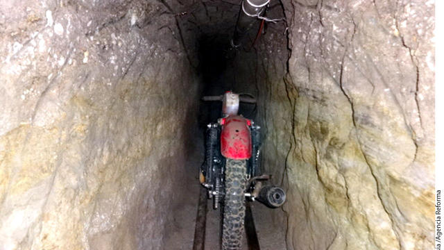 A motorcycle sits on rails inside the alleged escape tunnel that was constructed three stories underground through dirt and rock for Joaquin "El Chapo" Guzman's escape from a Mexican prison in 2015. 