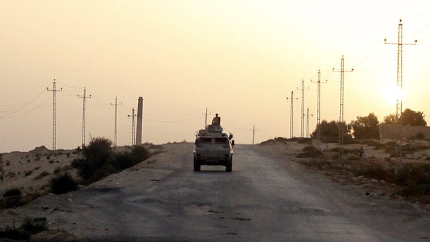 An Egyptian military vehicle is seen on the highway in northern Sinai, Egypt, May 25, 2015. 