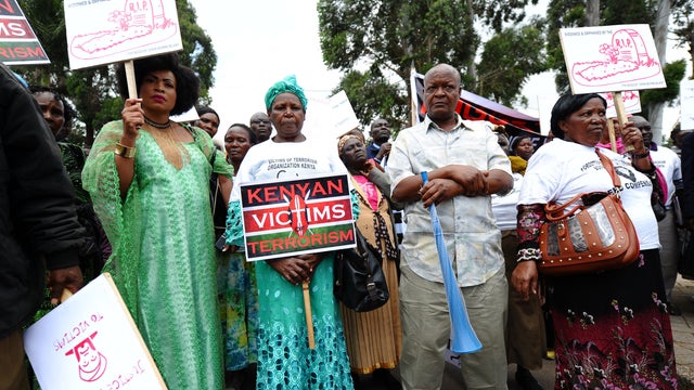 August 1998 bomb blast victims gather at the August 7th Memorial Park, during a peaceful march to deliver a petition to the American Embassy in the Kenyan capital Nairobi, demanding compensation and accusing the US government of turning 'a deaf ear' to th 