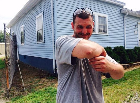 Nick Anderson demonstrates the stranglehold he put on an alleged robber at a North Carolina restaurant. He was dining with his girlfriend, who he planned to propose to during dinner.