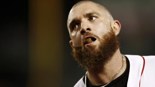 Jonny Gomes, #5 of the Boston Red Sox, spits out chewing tobacco after grounding into a double play against the Baltimore Orioles at Fenway Park Aug. 29, 2013, in Boston, Massachusetts. 