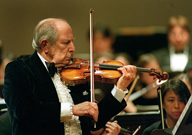 Roman Totenberg from Newton, Massachusetts, plays the violin solo for his 90th birthday concert celebration on stage at Boston University's Tsai Performance Center Feb. 5, 2001. 
