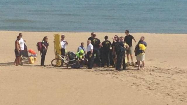 A parachutist receives medical attention at North Avenue Beach during the Air and Water Show Aug. 15, 2015, in Chicago. 