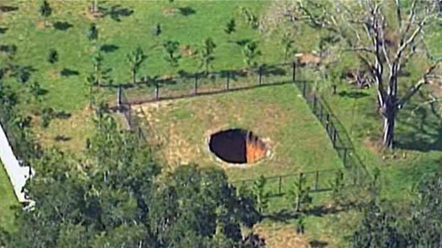 ​A sinkhole is seen in Seffner, Florida, Aug. 19, 2015. 