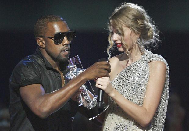 September 2009 file photo shows Kanye West taking microphone from Taylor Swift as she accepts "Best Female Video" award during MTV Video Music Awards in New York 