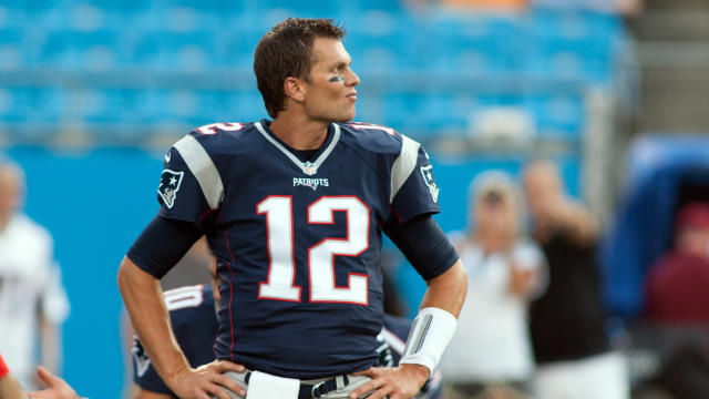 New England Patriots quarterback Tom Brady (12) stretches prior to the game against the Carolina Panthers at Bank of America Stadium in Charlotte, North Carolina, Aug. 28, 2015. 