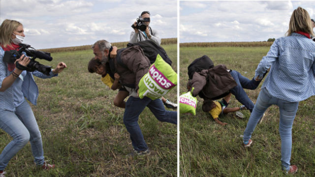 A migrant falls over a child as he tries to run away from the police on a field near a collection point in the village of Roszke, Hungary, Sept. 8, 2015. The Hungarian camerawoman, identified as Petra Laszlo, working for Nemzeti Televizio (N1TV), was caug 