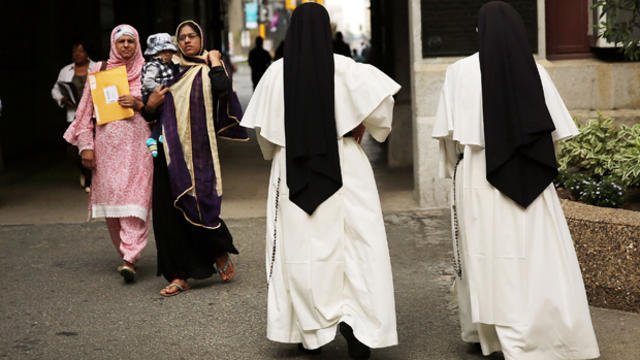 Two nuns walk through downtown Philadelphia Sept. 22, 2015, where Pope Francis is scheduled to visit. 