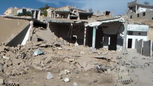 This image capture from online video posted by Syrian opposition activists purports to show damage from Russian airstrikes in Latamneh, in the northern Syrian governate of Hama, Sept. 30, 2015. 