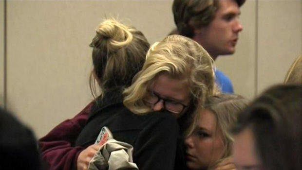 Two women embrace before Northern Arizona University officials hold a press conference on a deadly shooting on the campus in Flagstaff, Arizona, Oct. 9, 2015. 