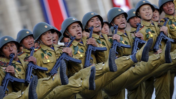 Soldiers shout slogans as they march past a stand with North Korean leader Kim Jong Un during the parade celebrating the 70th anniversary of the founding of the ruling Workers' Party of Korea in Pyongyang Oct. 10, 2015. 