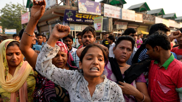 Indian protesters shout slogans during a demonstration near the home of a girl who was raped in New Delhi Oct. 17, 2015. 
