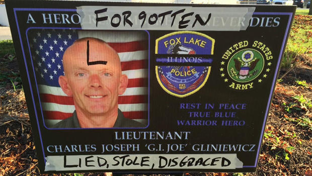 Defaced memorial sign for police Lt. Charles Joseph Gliniewicz was placed outside the police department in Fox Lake, Illinois, on Nov. 4, 2015 