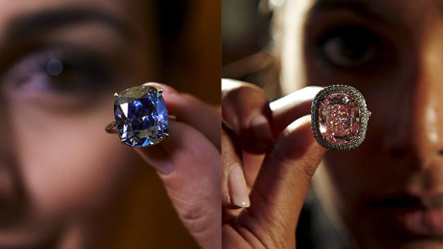 In this side-by-side image, the 12.03-carat "Blue Moon" diamond, left, is seen mounted on a ring at Sotheby's auction house in Geneva, Switzerland, Nov. 4, 2015. At right, a cushion-shaped 16.08-carat vivid pink diamond is seen at Christie's auction house 