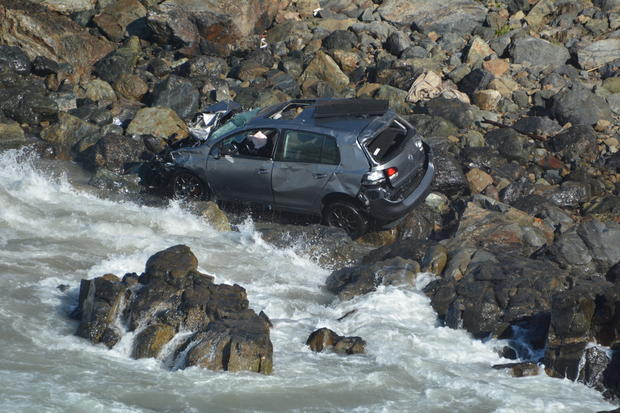 Car plunges off cliff 
