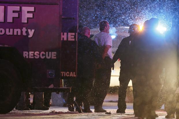 A suspect, identified as Robert Lewis Dear of North Carolina, is taken into custody outside a Planned Parenthood center in Colorado Springs, Colorado, Nov. 27, 2015. 
