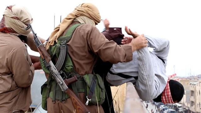 ​An unverified image posted online by ISIS supporters shows militants from the group throwing a man accused of being homosexual off the roof of a building in Fallujah 